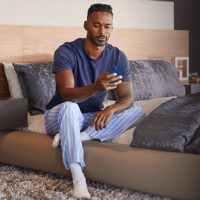 Waking in a calm bedroom, phone in hand