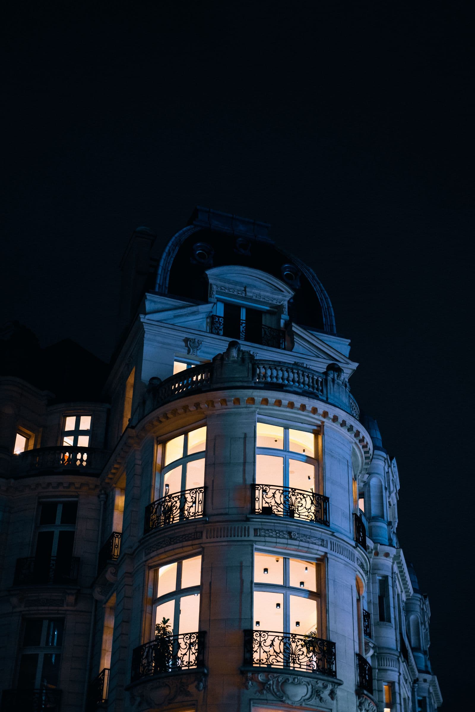 A luxury multi-dwelling building at night