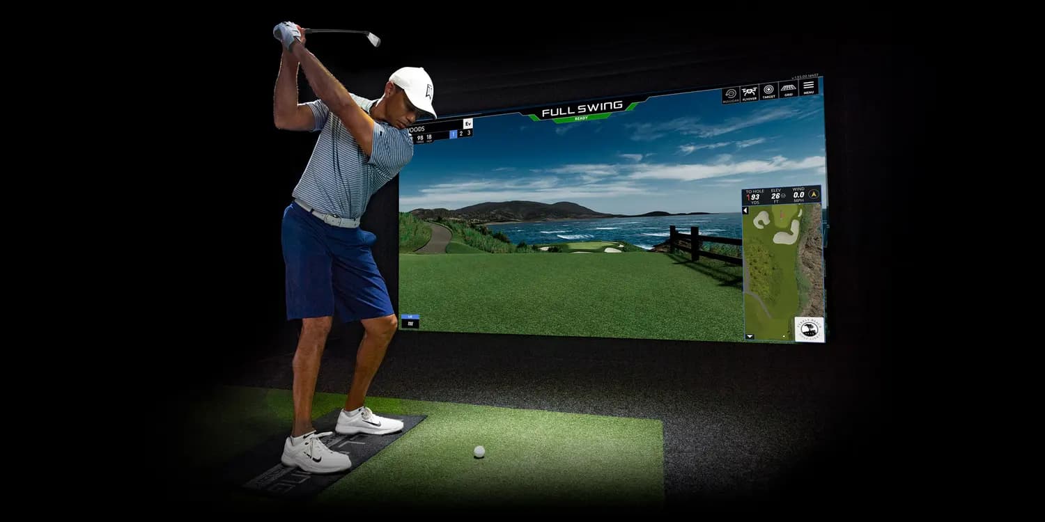 A dedicated home simulator room, screen lit, built like a theater