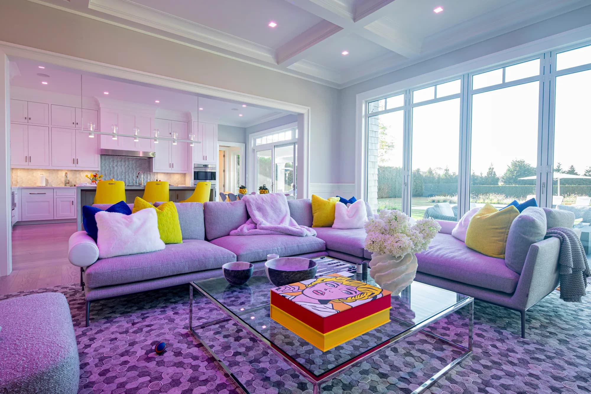 A Hamptons terrace set for a full house at dusk, audio and light carrying to the pool
