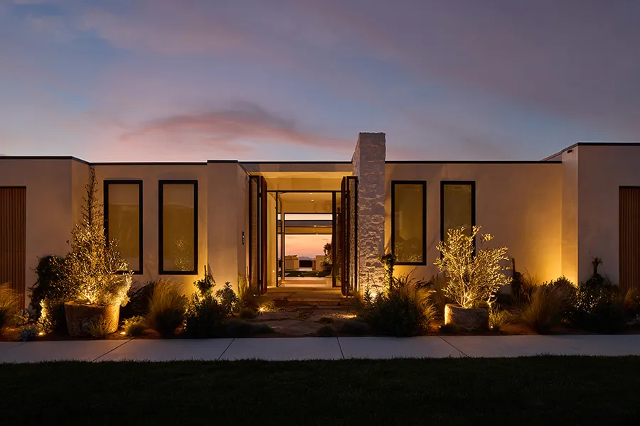 Warm Coastal Source lighting on a modern entry at dusk