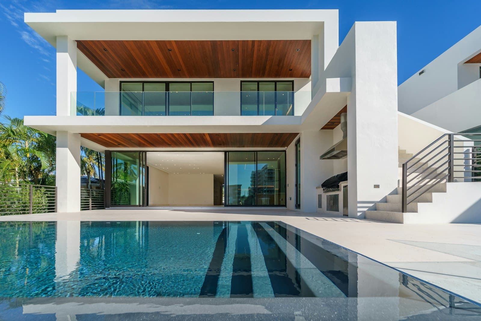 A modern luxury home lit at dusk