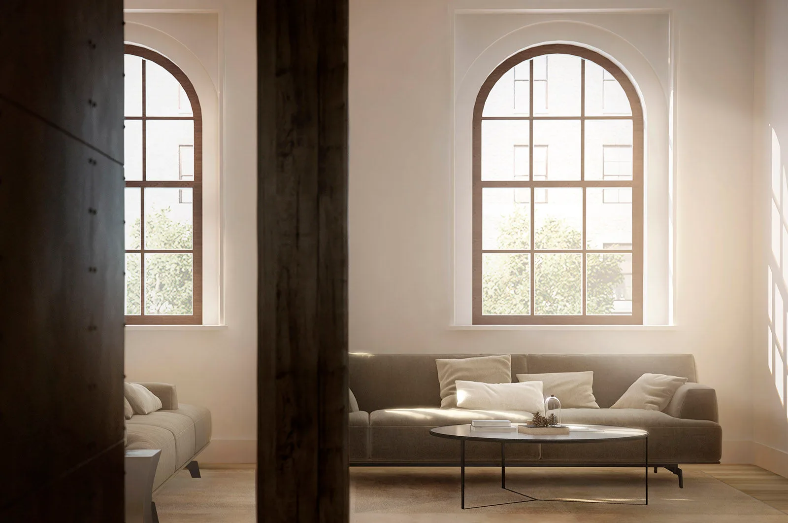 A light-filled loft residence with restored timber columns and arched windows