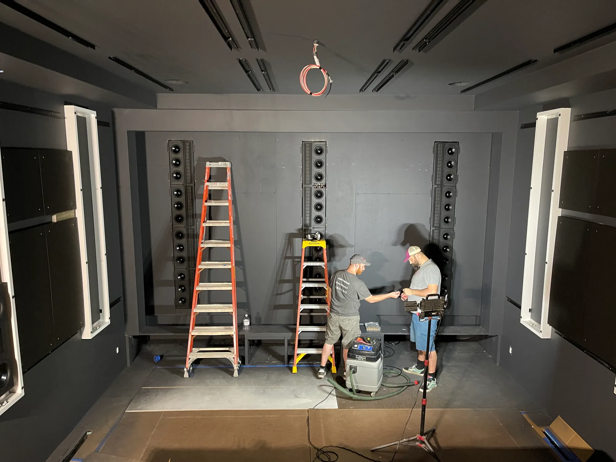The theater's front speakers going in by hand