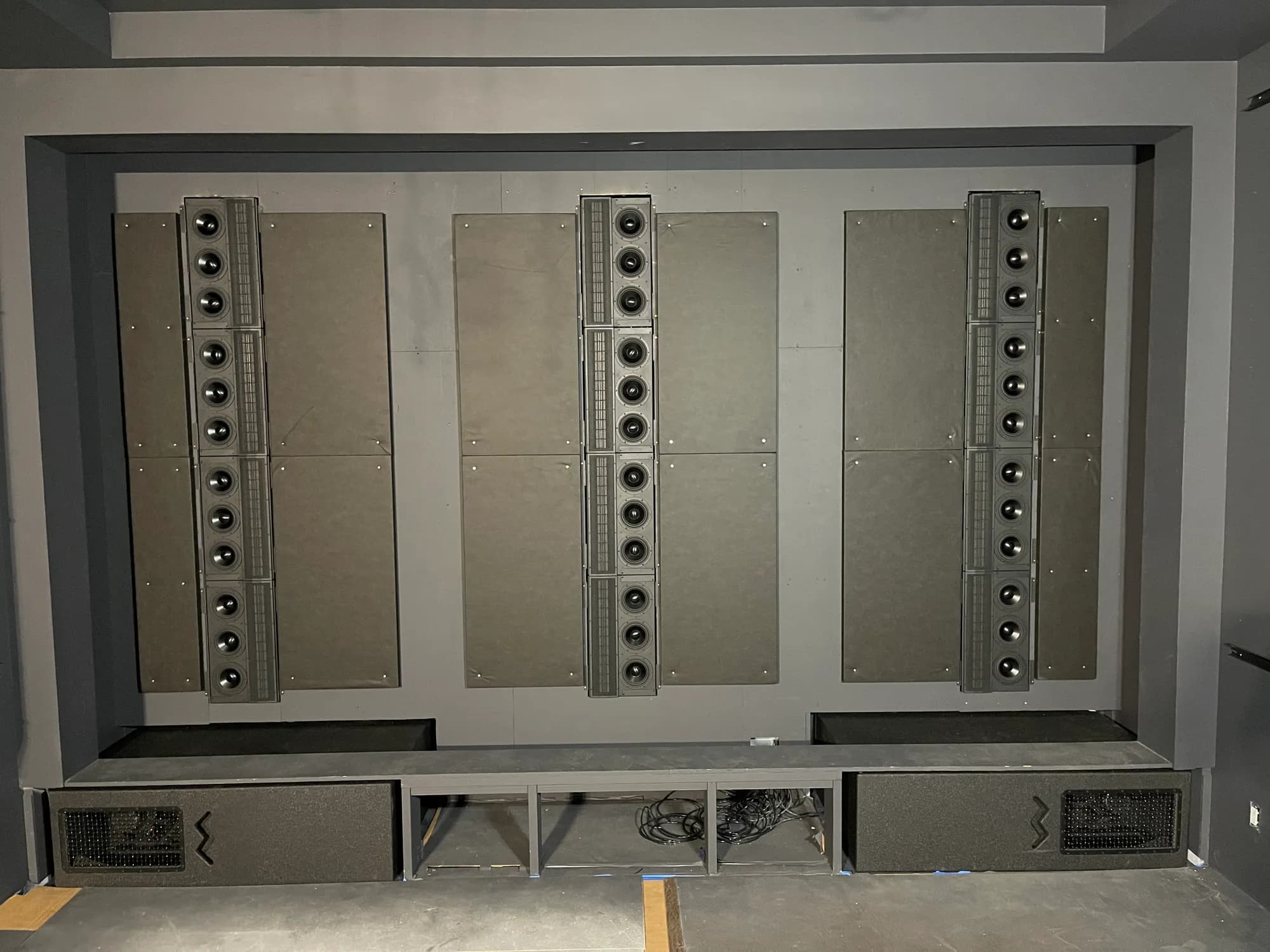 The front array, Wisdom Audio behind an acoustically transparent screen