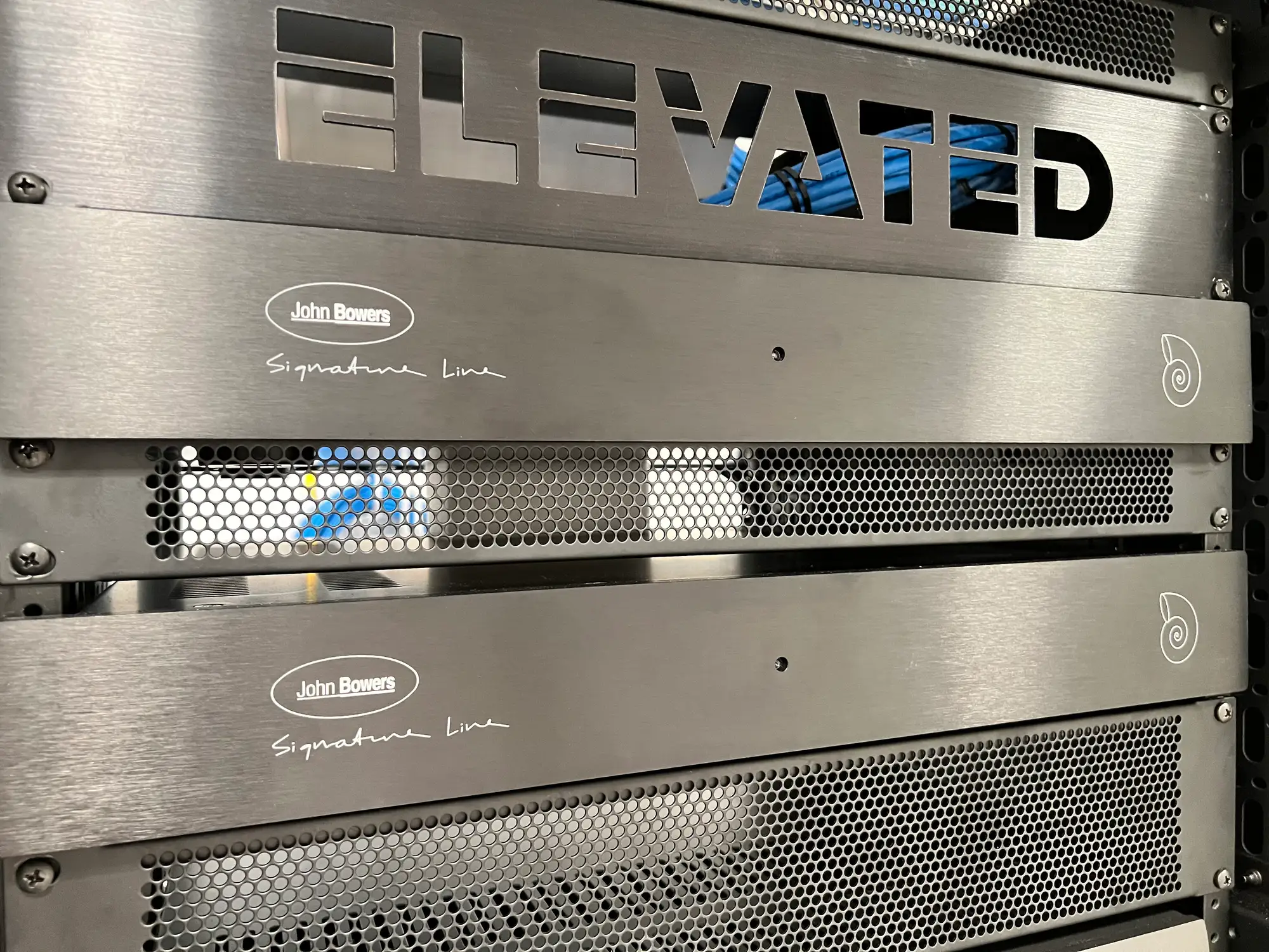A room of equipment racks carrying the estate, wired and labeled to the last connection
