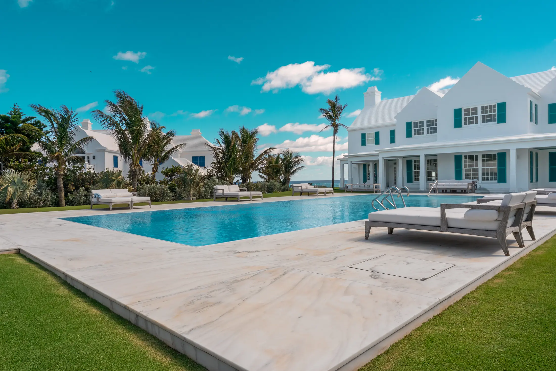 The pool and palms at the estate