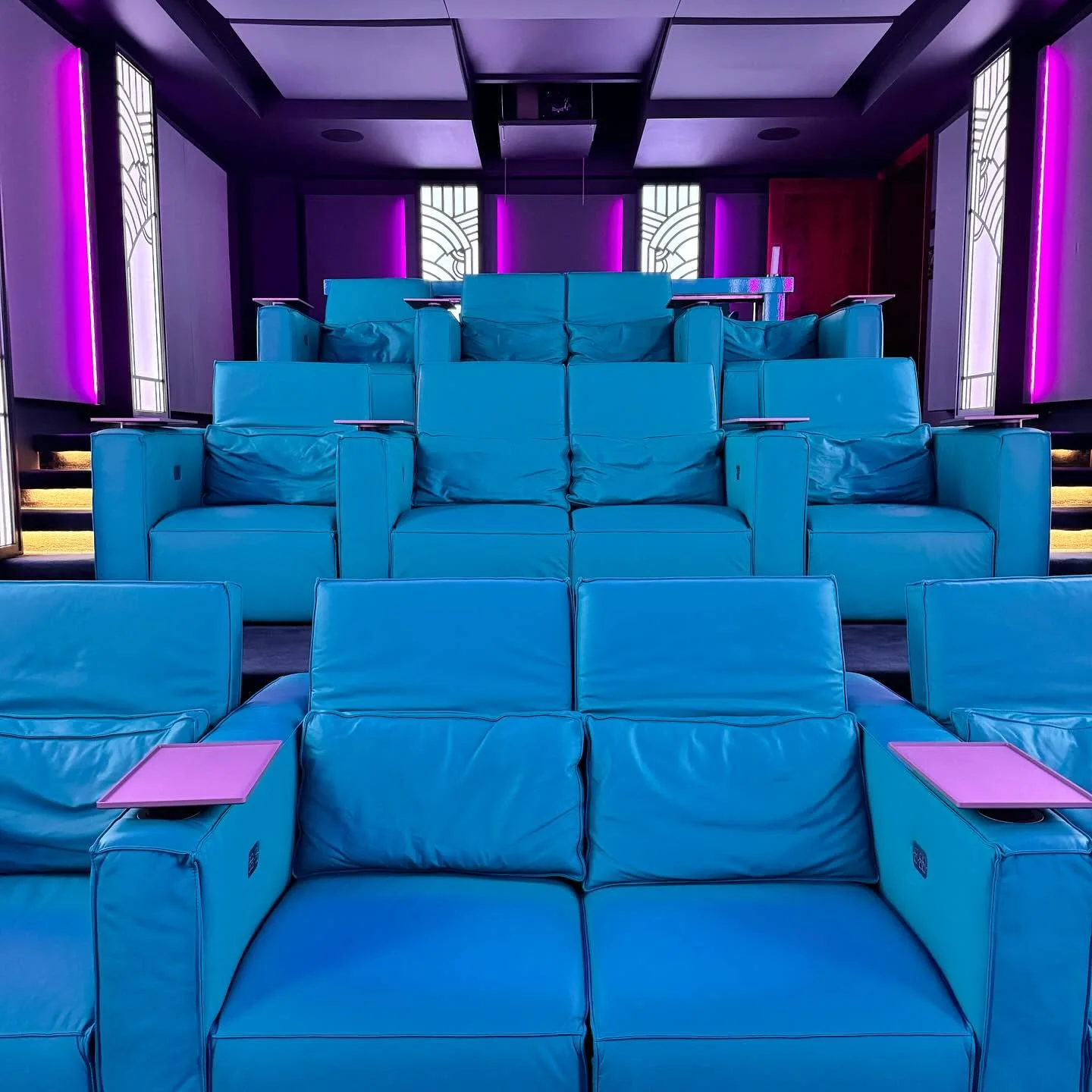 The cinema head-on, tiered rows of Cineak leather seating
