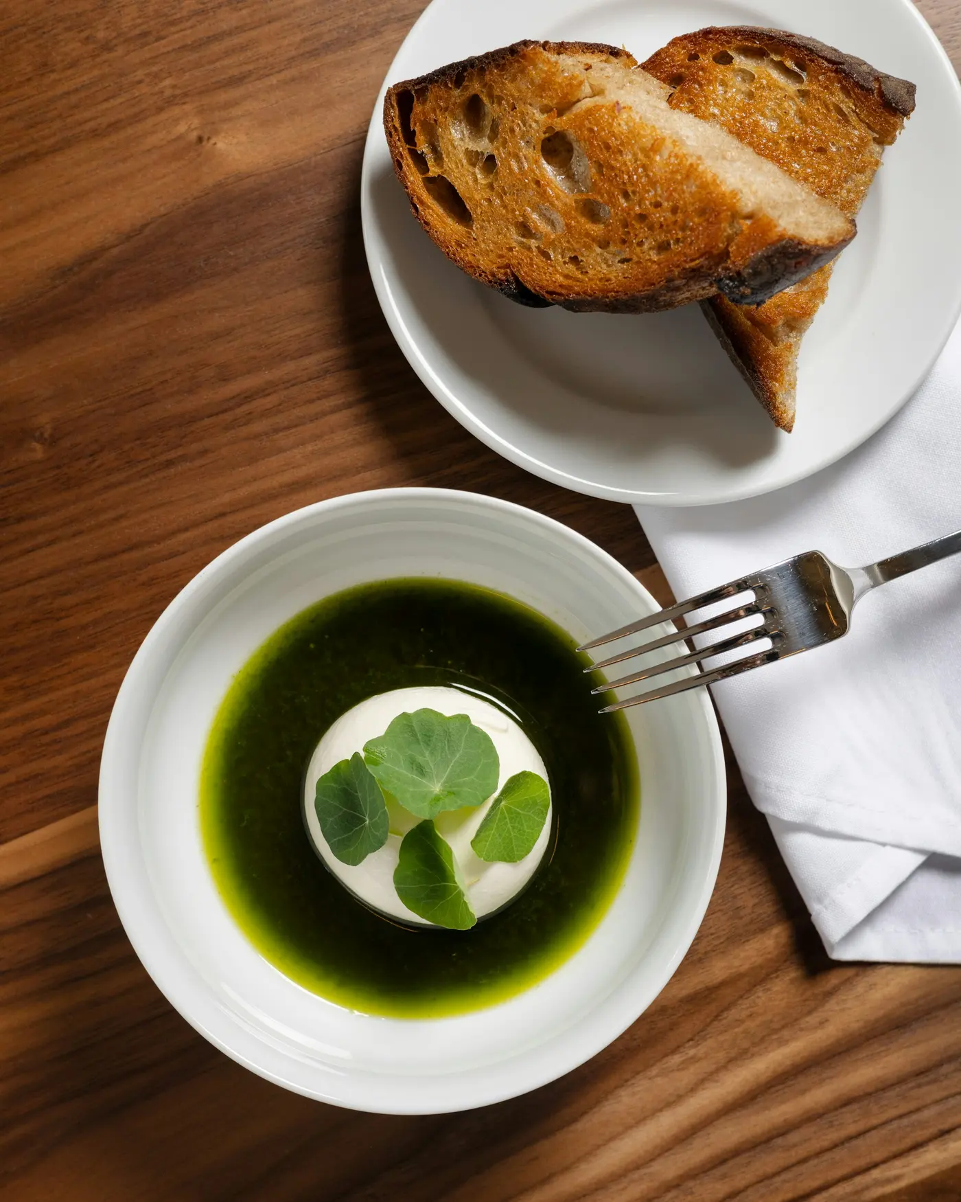A plated dish at Elm, warm light falling across the table