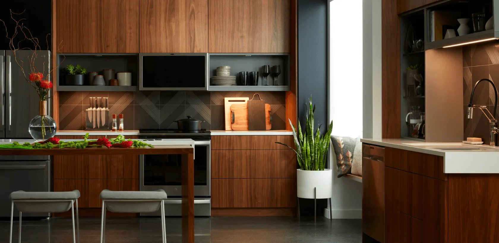 A warm walnut kitchen under tunable Savant light, from cool daylight to warm evening