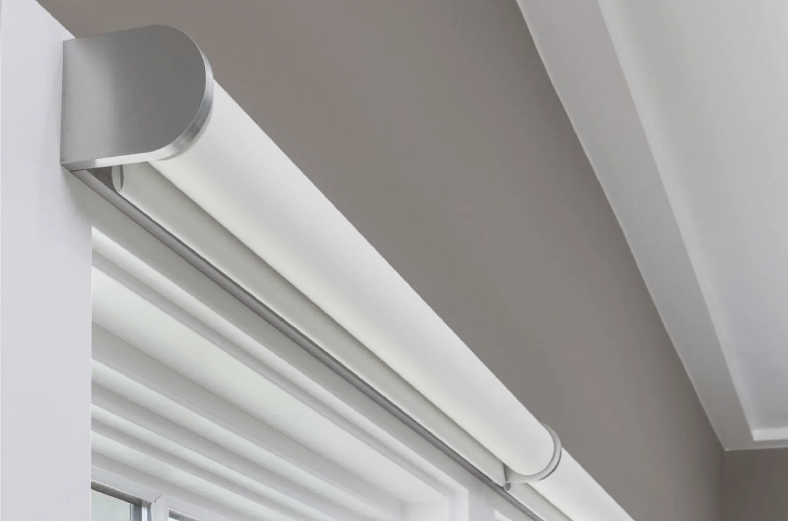 A minimal brushed-aluminum Savant Proseo shade headrail, no visible wires or screws